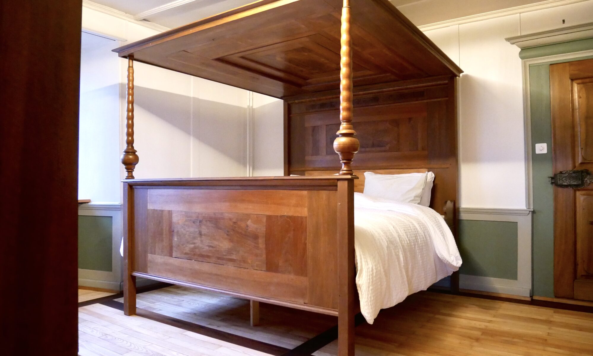 lengthened and widened four-poster bed