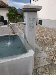 fountain stand with inscription: “With you is the source of all life”